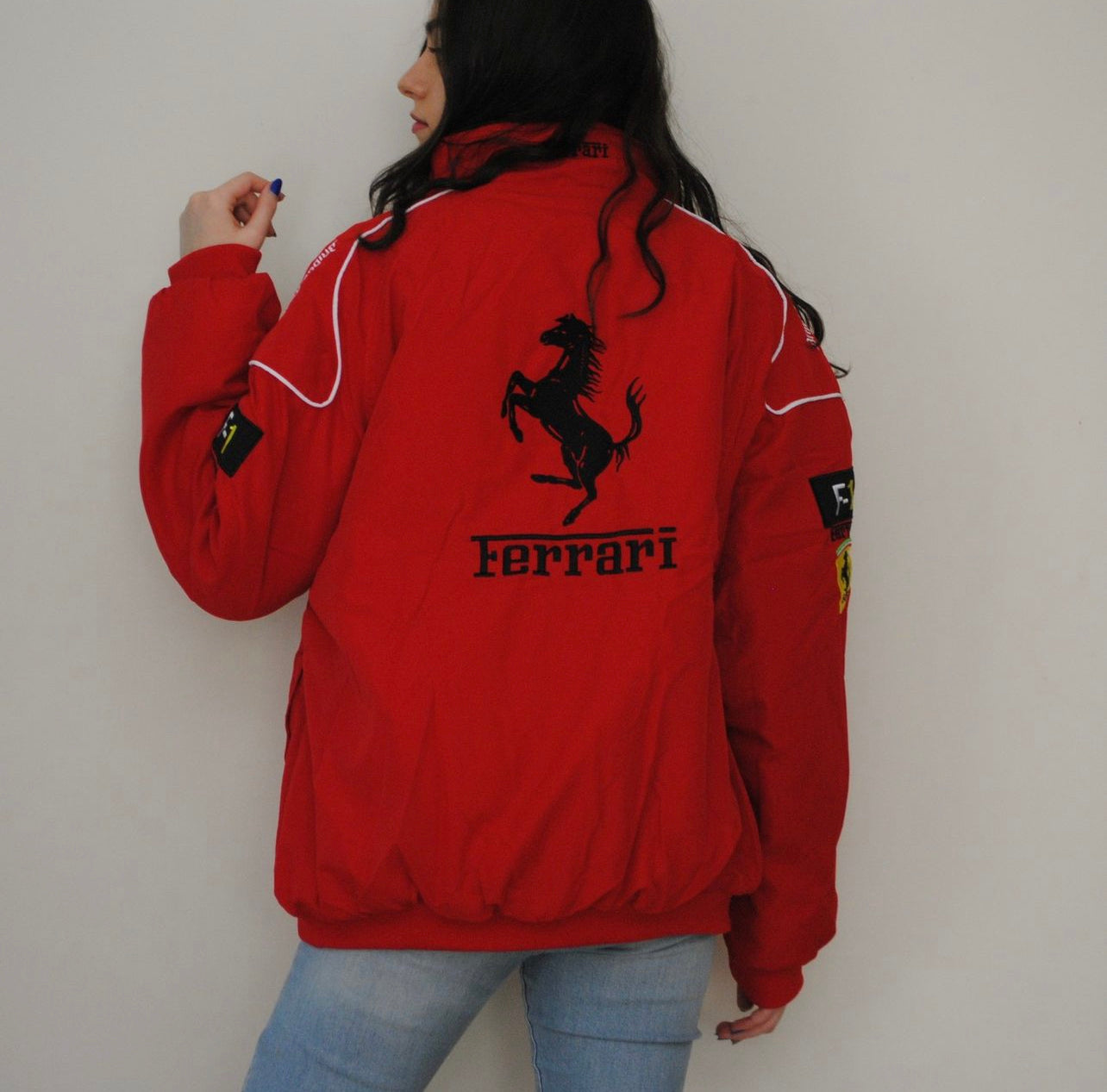vintage red Ferrari jacket with Ferrari logos on chest and F1 patch on sleeves