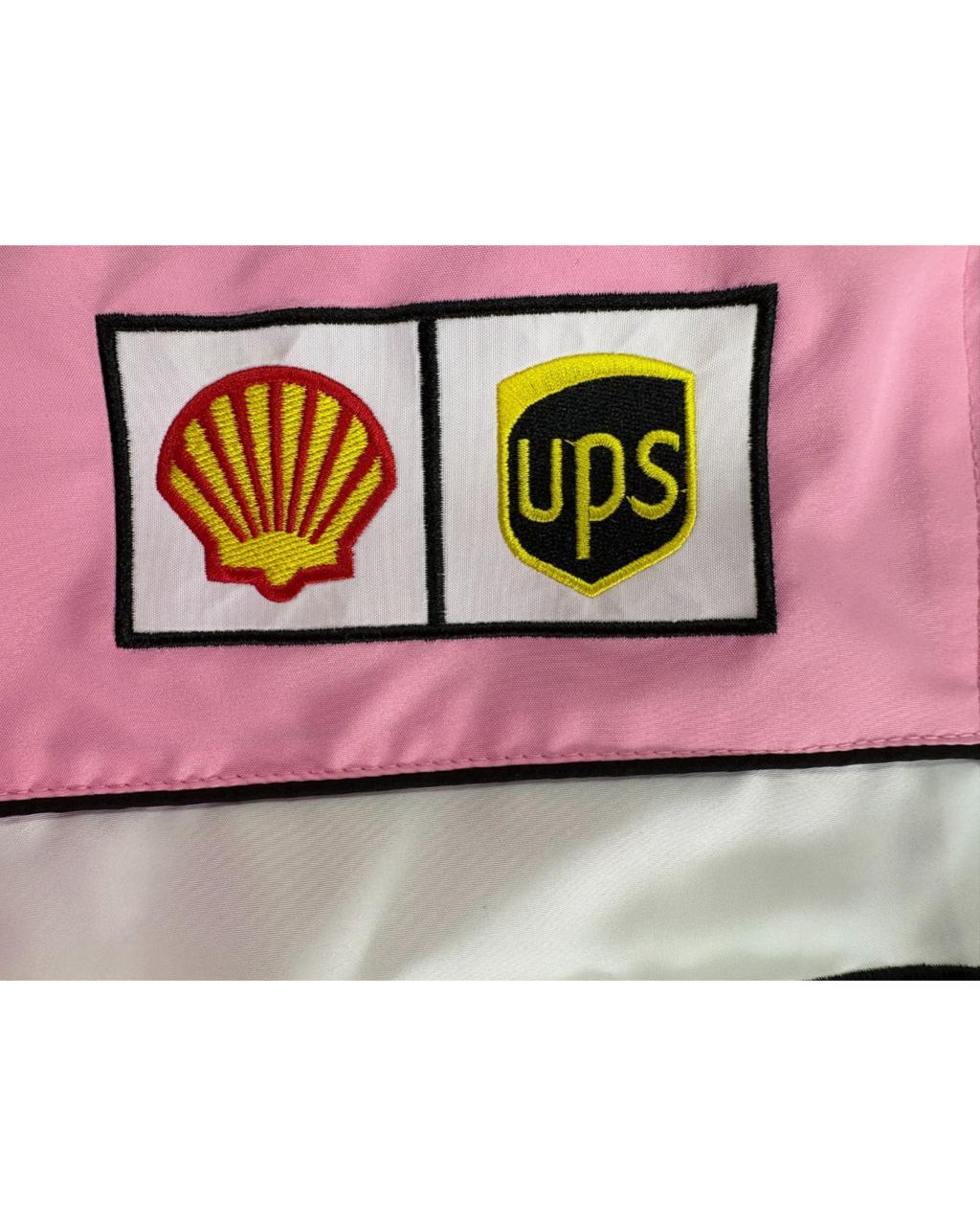 pink Ferrari racing jacket with sponsor patches and F1 logos in vintage style
