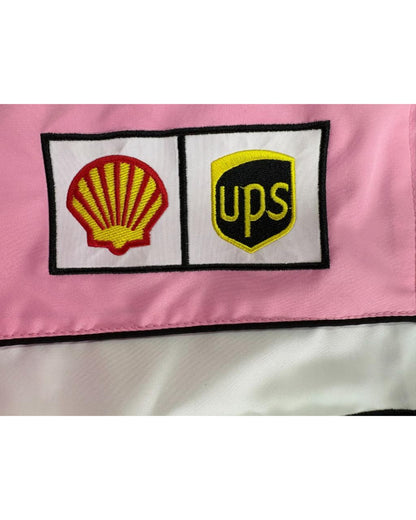 pink Ferrari racing jacket with sponsor patches and F1 logos in vintage style