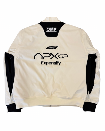 APX GP Brad Pitt F1 racing jacket back view with IWC and sponsor patches from the 2025 F1 movie