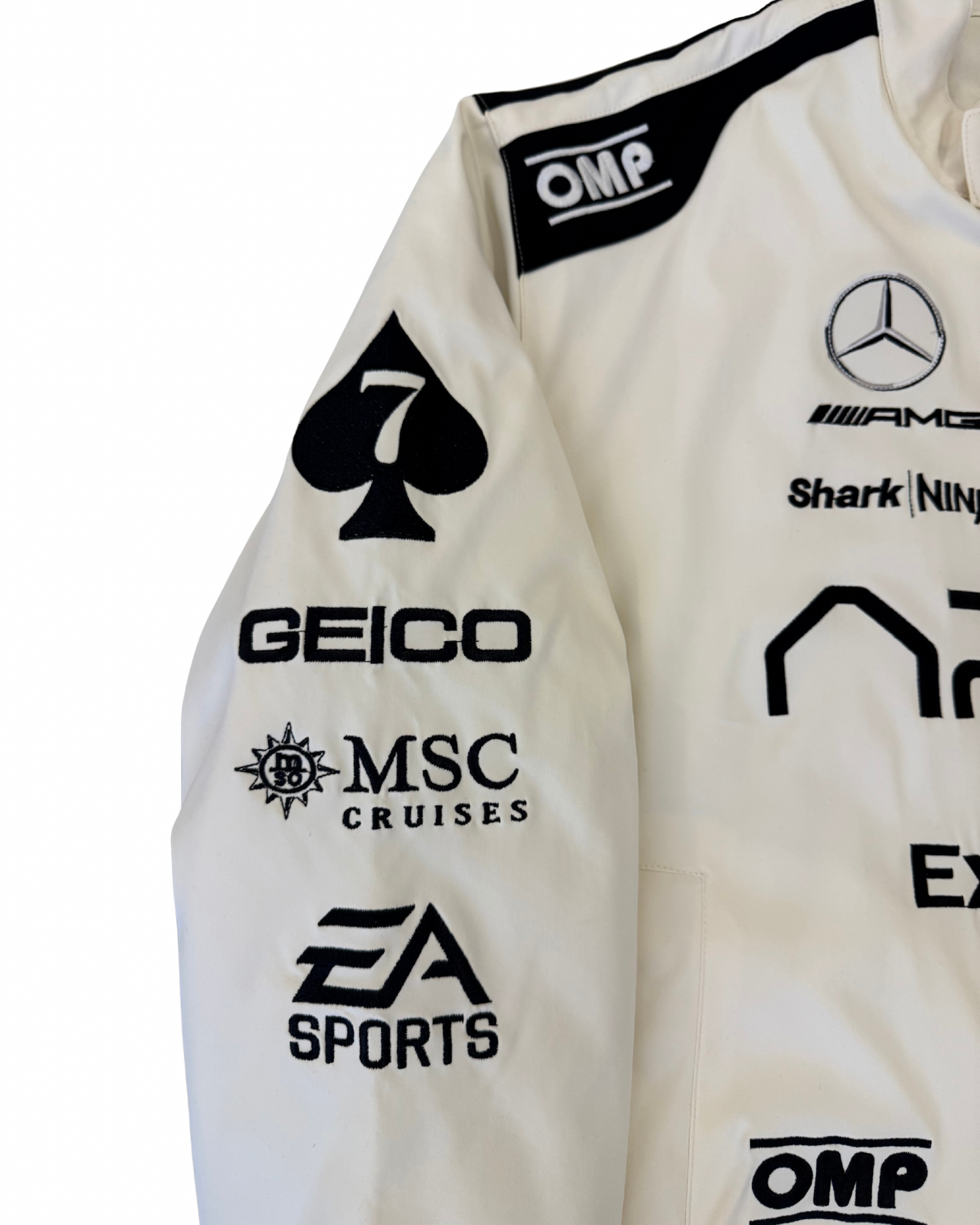 Close-up of APX GP F1 movie jacket chest with IWC patch and APX GP logo branding