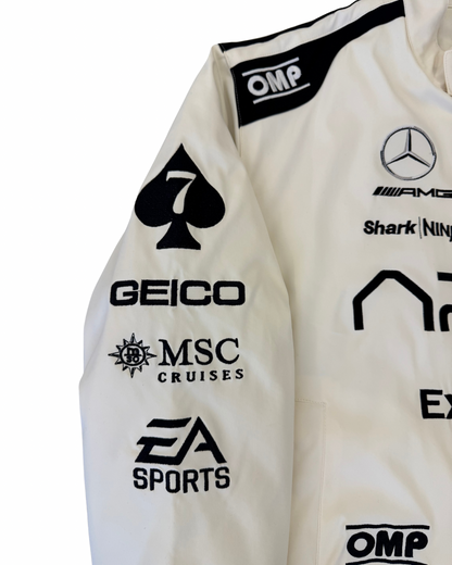 Close-up of APX GP F1 movie jacket chest with IWC patch and APX GP logo branding