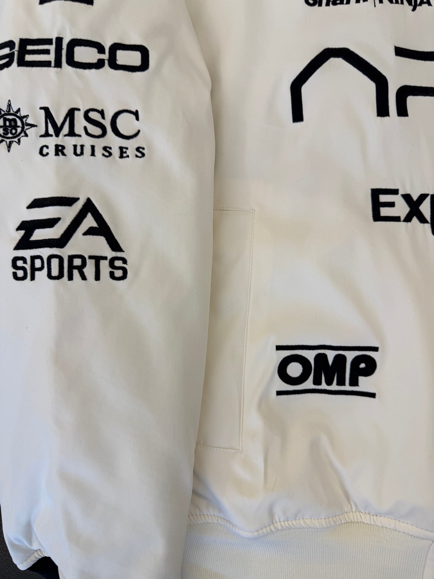 APX GP F1 movie jacket worn on model, retro racing streetwear inspired by Brad Pitt F1 film 2025