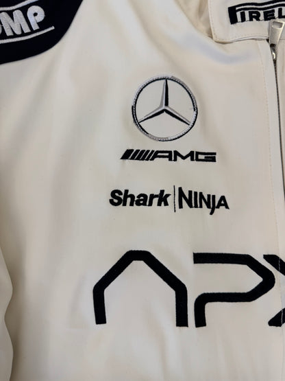 APX GP racing jacket front zip detail with embroidered APX logo and metallic hardware